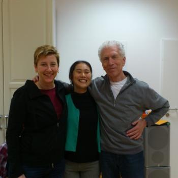 Harvey Burns with friends at a Rolfing event, laughing and enjoying the moment